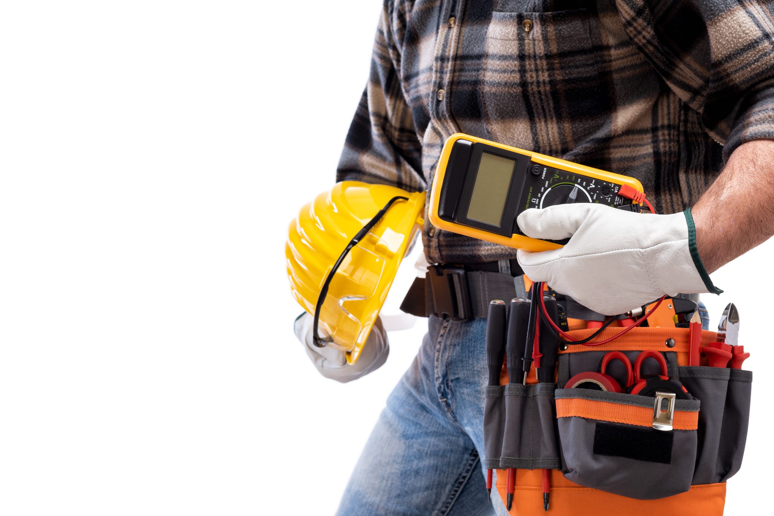 Electrician holds multimeter tester in hand, helmet with protective goggles. Construction industry, electrical system. Isolated on a white background.